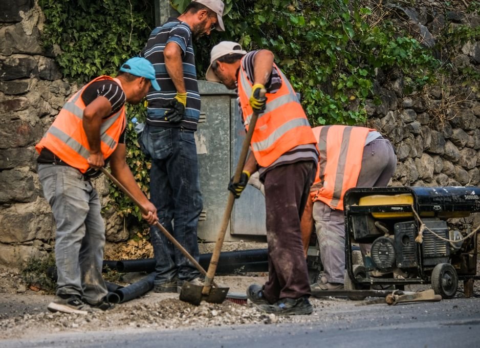 Two workers on a construction site during daytime