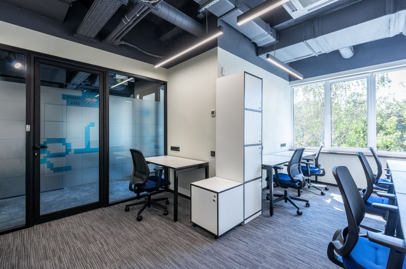 Modern office with wooden tables and chairs