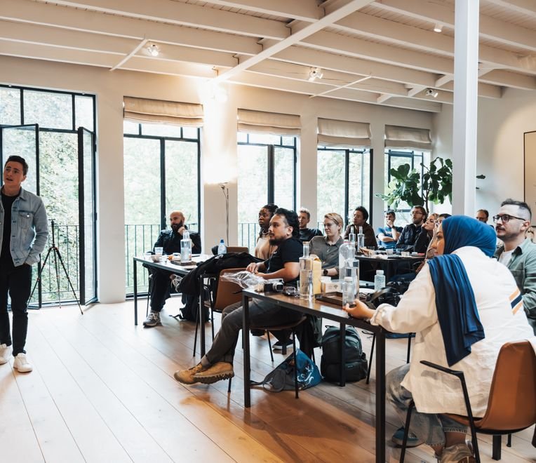 Professionals attending a training session in a modern office