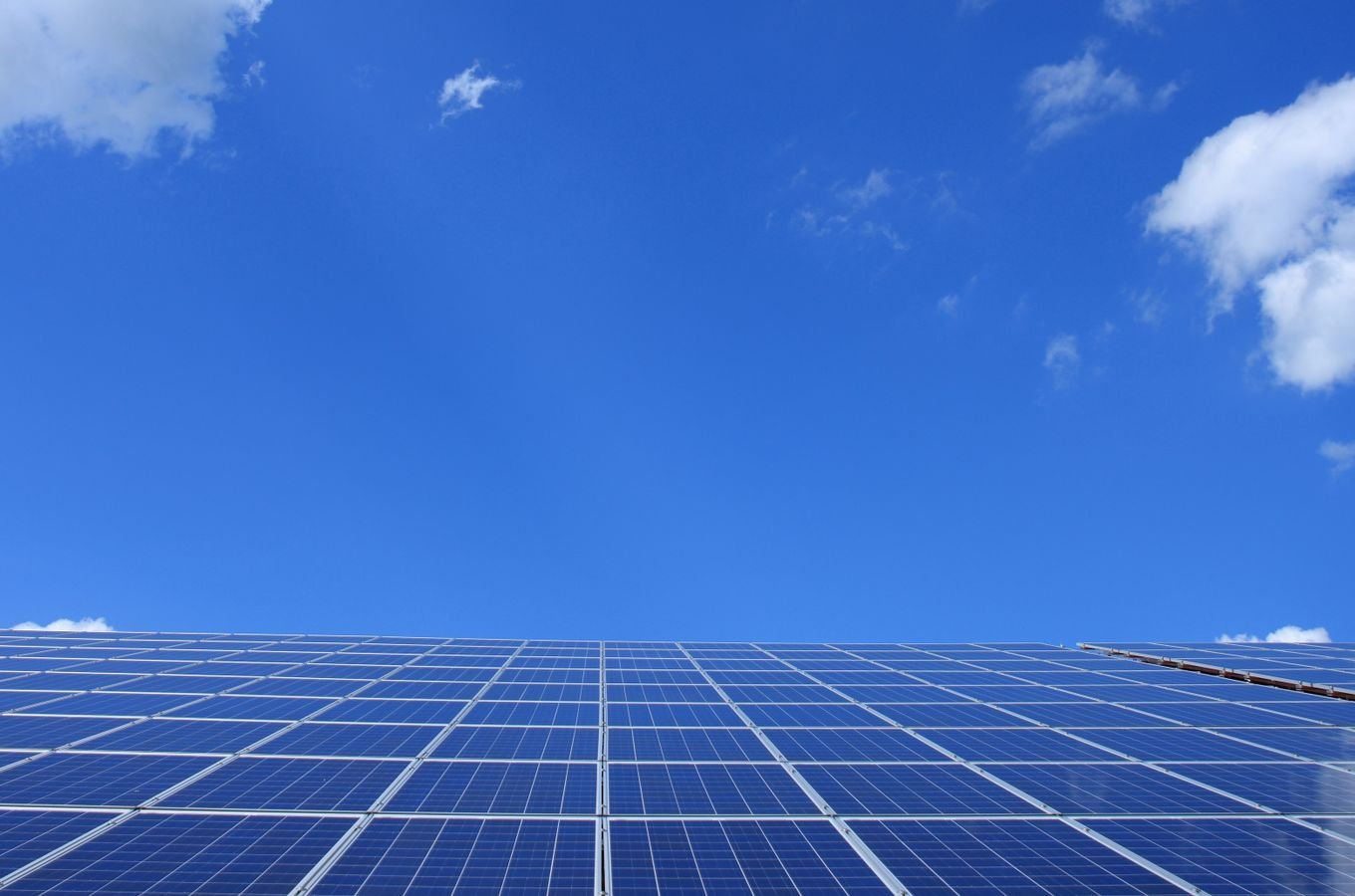 Solar panels capturing energy under a sunny sky